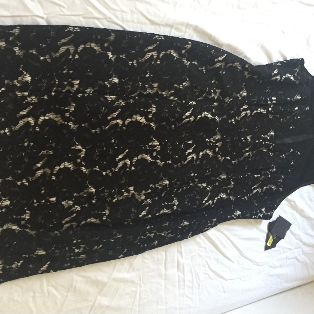 Beautiful Black Lace Dress. Great brand of Vince Camuto. Size 10 with slit cut.